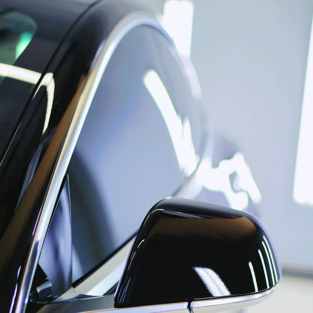 Black tesla with automotive window tinting applied